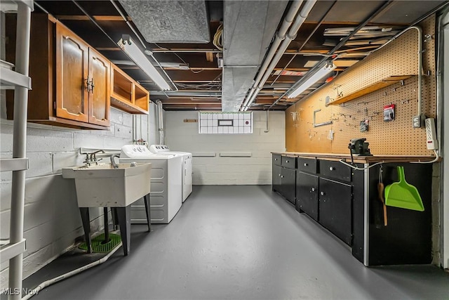 21517 Nottingham Dr, Fairview Park, OH 44126 - basement with independent washer and dryer, a sink, concrete block wall, and a workshop area