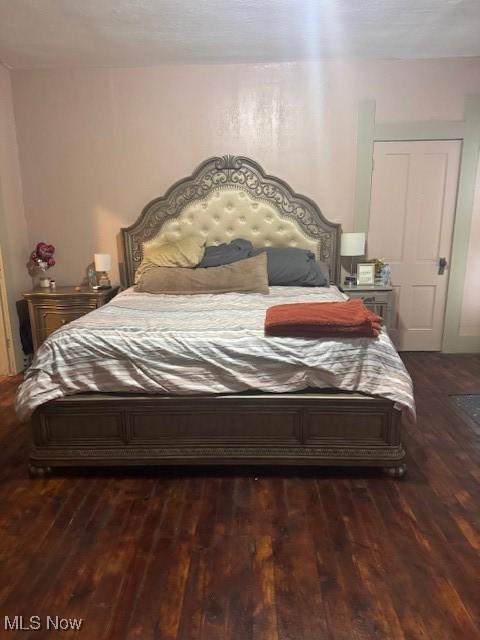 419 Commerce St, Wellsburg, WV 26070 - bedroom featuring dark wood-type flooring