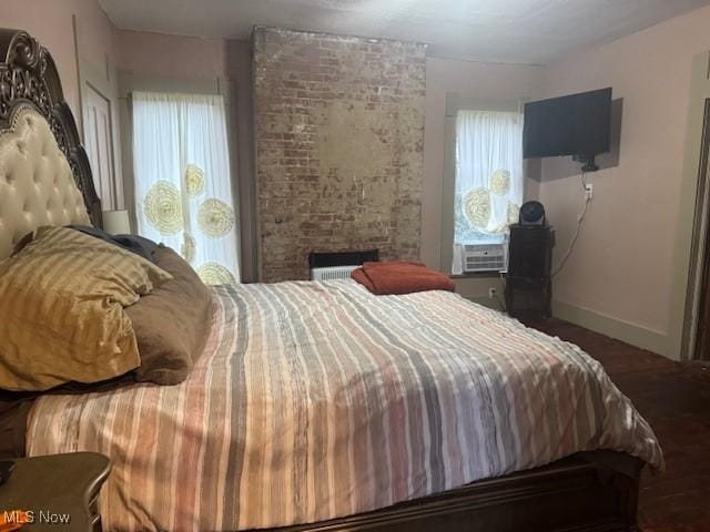 419 Commerce St, Wellsburg, WV 26070 - bedroom with baseboards, wood finished floors, and cooling unit