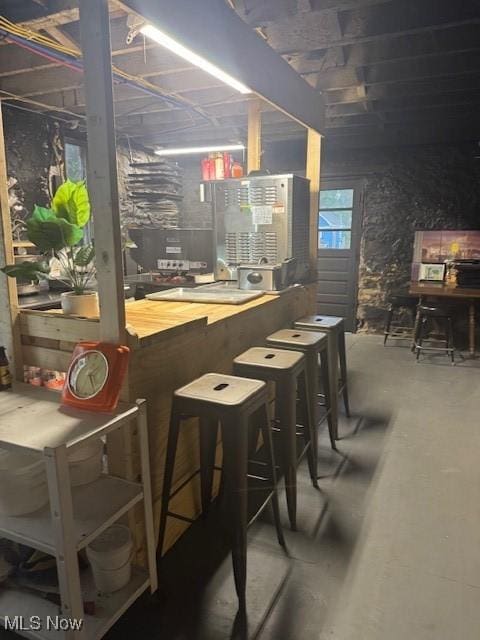 419 Commerce St, Wellsburg, WV 26070 - bar with unfinished concrete floors and a workshop area