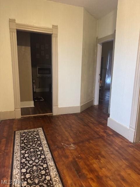 419 Commerce St, Wellsburg, WV 26070 - hallway featuring hardwood / wood-style flooring and baseboards