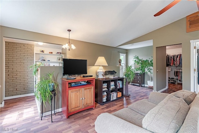 7170 Lafayette Rd, Medina, OH 44256 - living room featuring light wood-type flooring, vaulted ceiling, baseboards, and ceiling fan