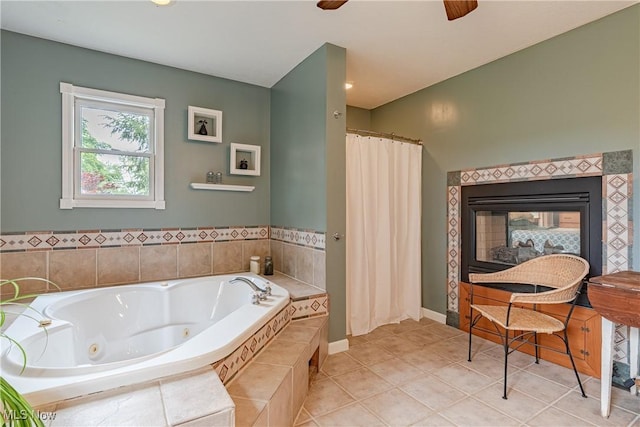 7170 Lafayette Rd, Medina, OH 44256 - full bathroom with a tub with jets, curtained shower, a tile fireplace, tile patterned floors, and a ceiling fan