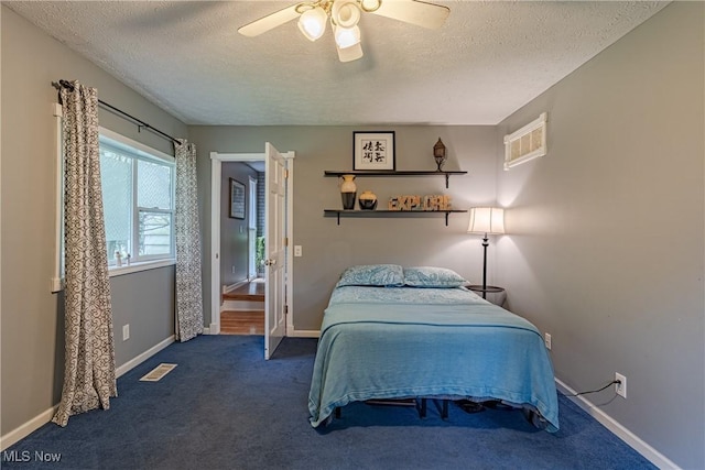 7170 Lafayette Rd, Medina, OH 44256 - bedroom featuring carpet flooring, a textured ceiling, ceiling fan, and baseboards