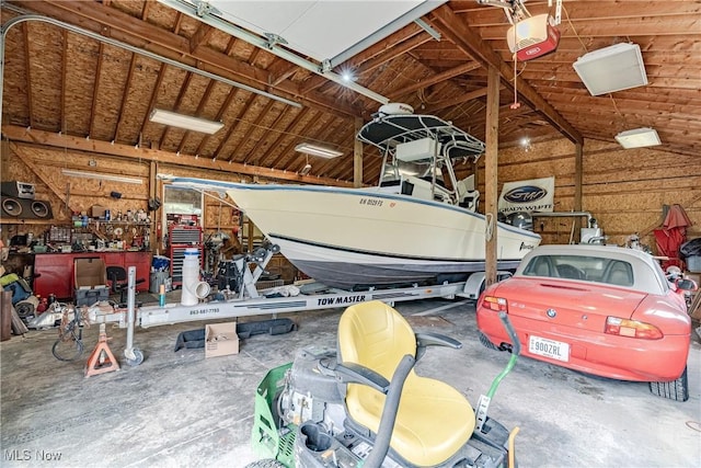 7170 Lafayette Rd, Medina, OH 44256 - garage with a garage door opener and a workshop area