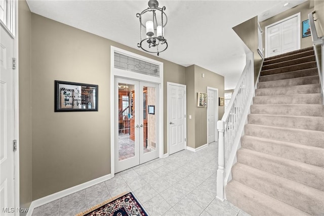 1955 Wendover Cir NE, North Canton, OH 44720 - foyer featuring stairway, baseboards, french doors, a chandelier, and light tile patterned flooring