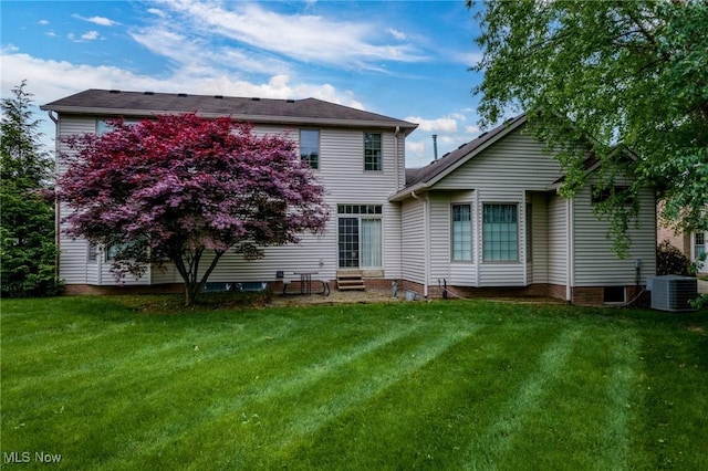 1955 Wendover Cir NE, North Canton, OH 44720 - rear view of property featuring entry steps, a lawn, and central AC unit