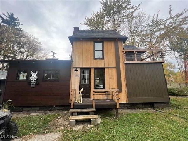 405 Bliss Ave, Conneaut, OH 44030 - rear view of property featuring a chimney
