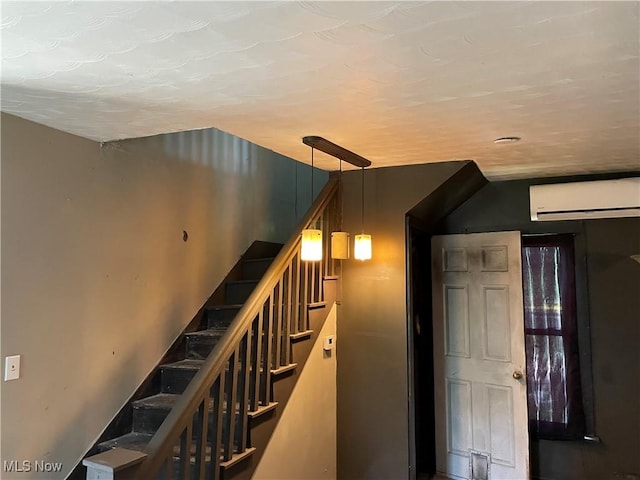 405 Bliss Ave, Conneaut, OH 44030 - staircase featuring a wall unit AC