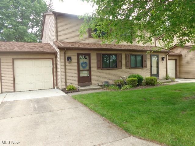 816 Gino Ln Unit 816, Cleveland, OH 44109 - multi unit property with driveway, an attached garage, and a front yard