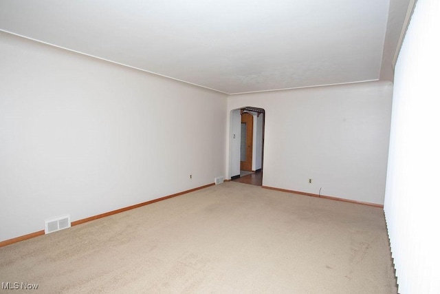 430 W Harvey St, Struthers, OH 44471 - carpeted spare room featuring arched walkways and baseboards