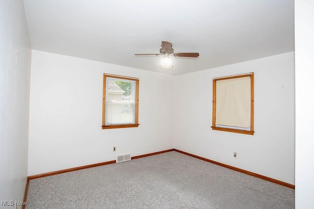 430 W Harvey St, Struthers, OH 44471 - empty room with ceiling fan, carpet flooring, and baseboards