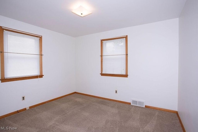 430 W Harvey St, Struthers, OH 44471 - carpeted empty room featuring baseboards