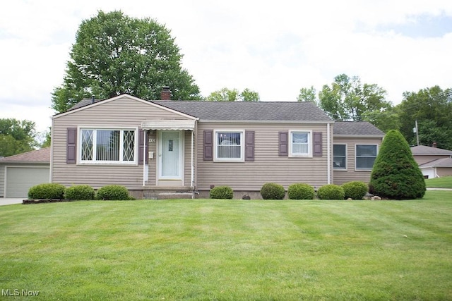 430 W Harvey St, Struthers, OH 44471 - ranch-style house featuring a front yard, a chimney, a garage, and a shingled roof