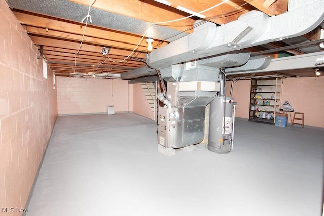 430 W Harvey St, Struthers, OH 44471 - unfinished below grade area featuring water heater, concrete block wall, and heating unit