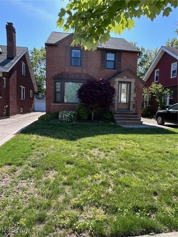 104 Sunnycliff Dr, Euclid, OH 44123 - view of front of house with brick siding and a front lawn