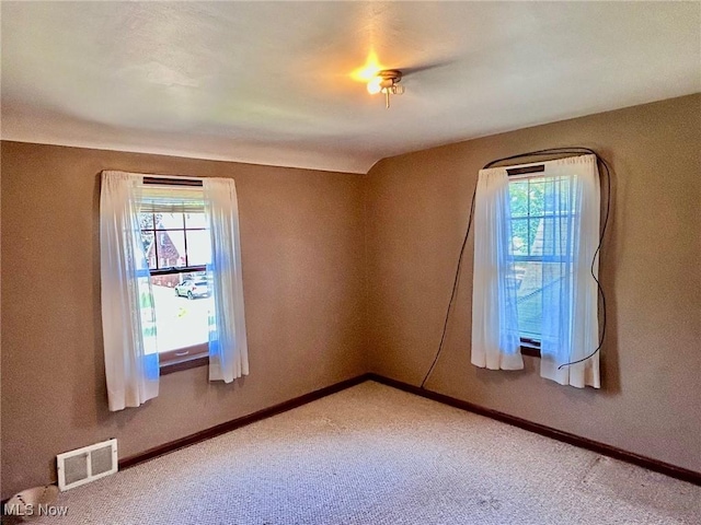 104 Sunnycliff Dr, Euclid, OH 44123 - empty room featuring plenty of natural light, carpet, and baseboards
