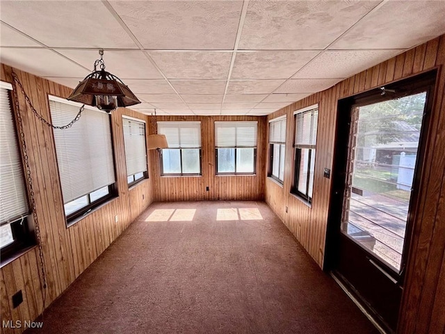 104 Sunnycliff Dr, Euclid, OH 44123 - unfurnished sunroom with wooden walls, carpet, and plenty of natural light