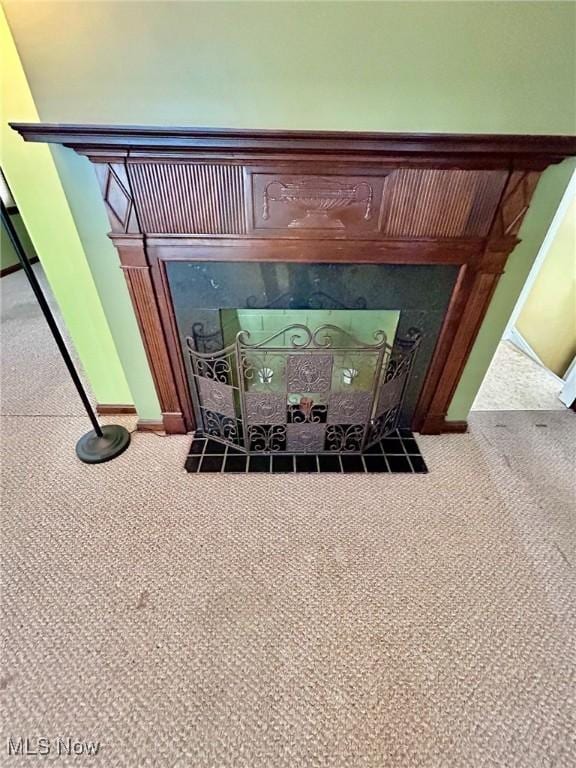 104 Sunnycliff Dr, Euclid, OH 44123 - detailed view of a fireplace, carpet flooring, and baseboards