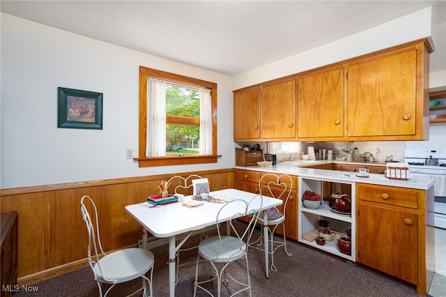 125 Beech St, Doylestown, OH 44230 - kitchen featuring gas range gas stove, brown cabinetry, light countertops, and open shelves