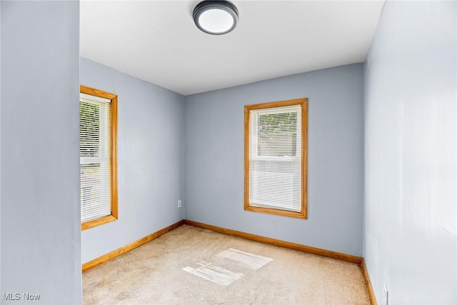 916 Kling St, Akron, OH 44311 - empty room with baseboards and light colored carpet