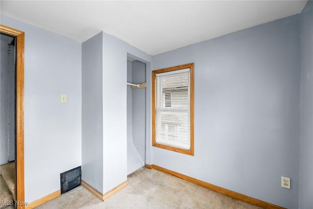 916 Kling St, Akron, OH 44311 - unfurnished bedroom featuring carpet and baseboards