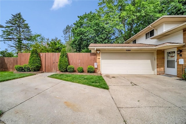 5512 Berkshire Dr, North Olmsted, OH 44070 - view of property exterior featuring a garage and driveway