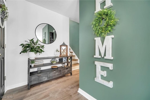 5512 Berkshire Dr, North Olmsted, OH 44070 - entrance foyer featuring wood finished floors, baseboards, and stairway