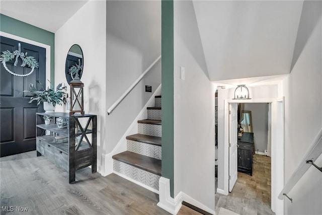 5512 Berkshire Dr, North Olmsted, OH 44070 - entrance foyer with wood finished floors, stairs, and baseboards