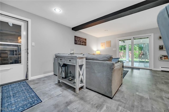 5512 Berkshire Dr, North Olmsted, OH 44070 - living area with wood finished floors, beam ceiling, baseboards, baseboard heating, and recessed lighting