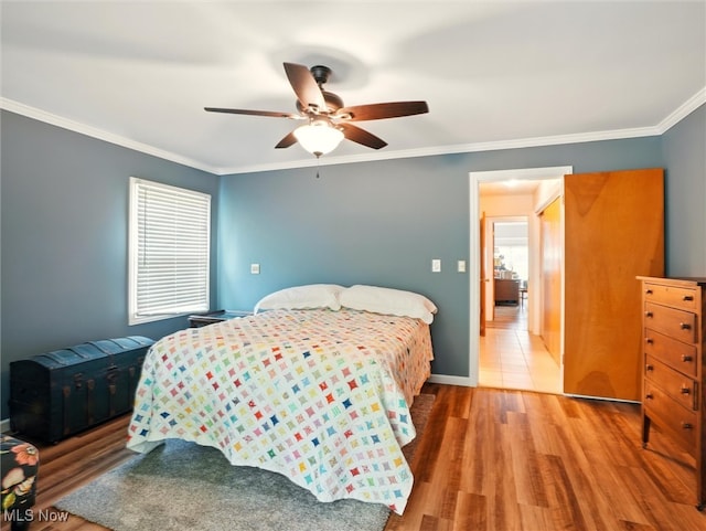 4300 Wade Ave, Ashtabula, OH 44004 - bedroom featuring wood finished floors, ornamental molding, and ceiling fan