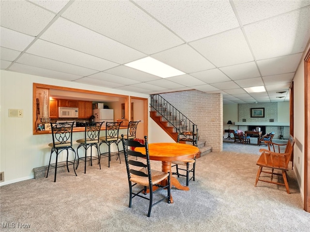 4300 Wade Ave, Ashtabula, OH 44004 - carpeted dining space featuring a drop ceiling and stairway