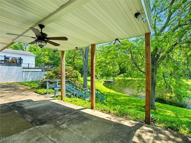 4300 Wade Ave, Ashtabula, OH 44004 - view of patio / terrace featuring a ceiling fan, view of wooded area, and a water view
