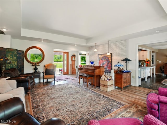 4300 Wade Ave, Ashtabula, OH 44004 - living area featuring a tray ceiling, wood finished floors, and recessed lighting