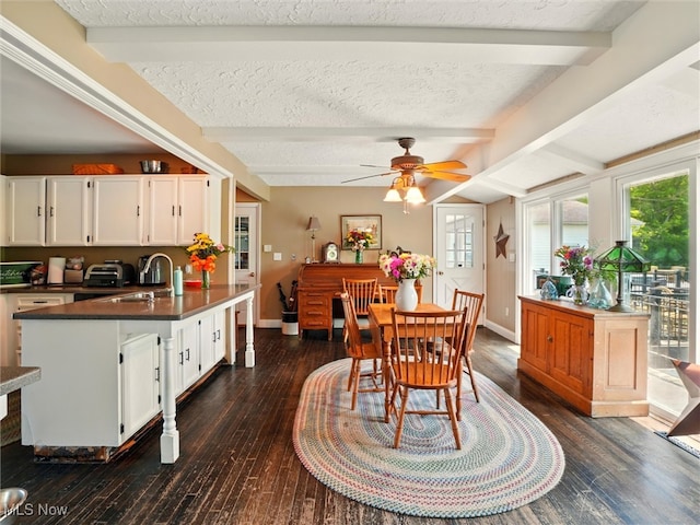 4300 Wade Ave, Ashtabula, OH 44004 - dining space with beam ceiling, dark wood-type flooring, a textured ceiling, and ceiling fan
