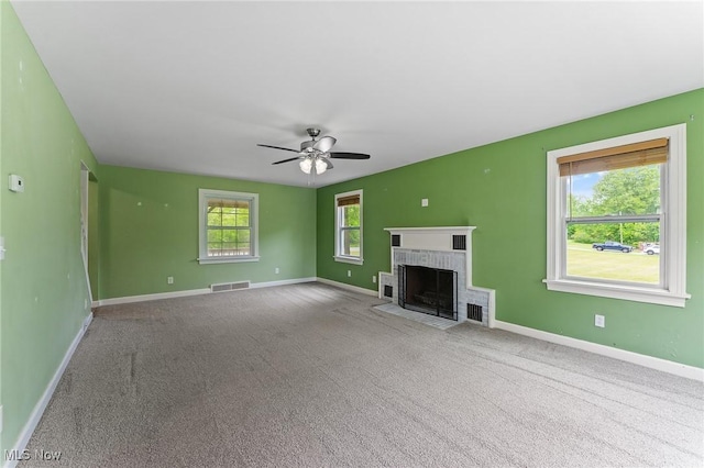 15800 Shilling Rd, Berlin Center, OH 44401 - unfurnished living room featuring baseboards, ceiling fan, a fireplace, and carpet floors