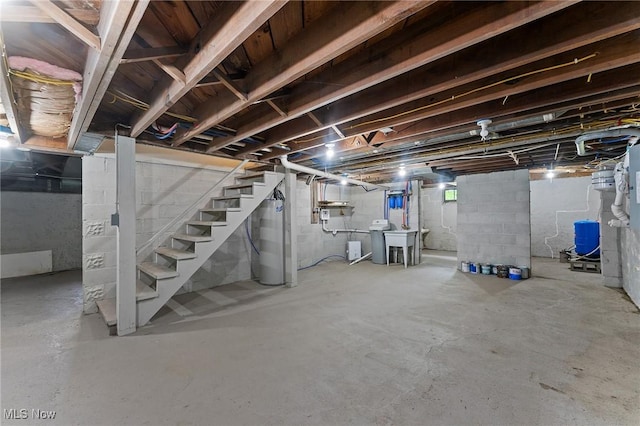 15800 Shilling Rd, Berlin Center, OH 44401 - unfinished basement featuring a water pressure tank, stairway, and water heater