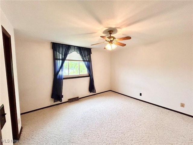 56400 Boyd Ave, Bridgeport, OH 43912 - empty room featuring a ceiling fan, carpet, and baseboards