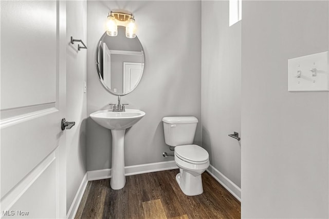 360 Bascule Dr, Lorain, OH 44052 - half bath featuring wood finished floors and toilet