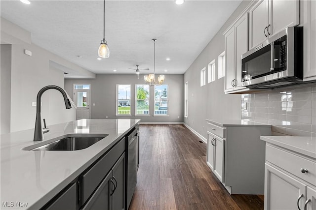 360 Bascule Dr, Lorain, OH 44052 - kitchen featuring appliances with stainless steel finishes, recessed lighting, light countertops, a chandelier, and pendant lighting