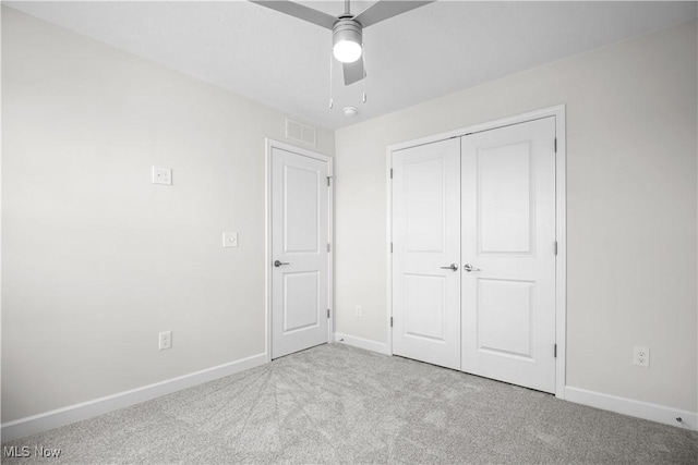 360 Bascule Dr, Lorain, OH 44052 - unfurnished bedroom with carpet, a closet, and a ceiling fan