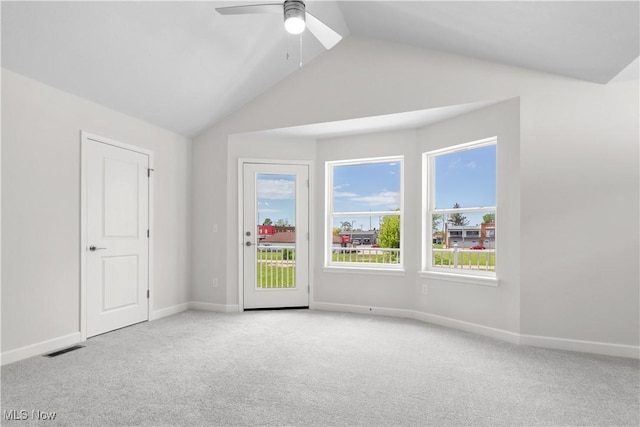 360 Bascule Dr, Lorain, OH 44052 - empty room with light colored carpet, vaulted ceiling, and ceiling fan