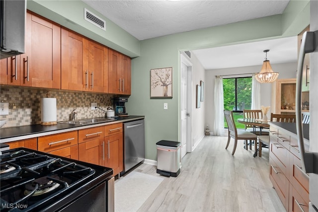 6290 Greenwood Pkwy Unit 402, Northfield, OH 44067 - kitchen with a sink, dishwasher, brown cabinetry, tasteful backsplash, and light wood-style flooring