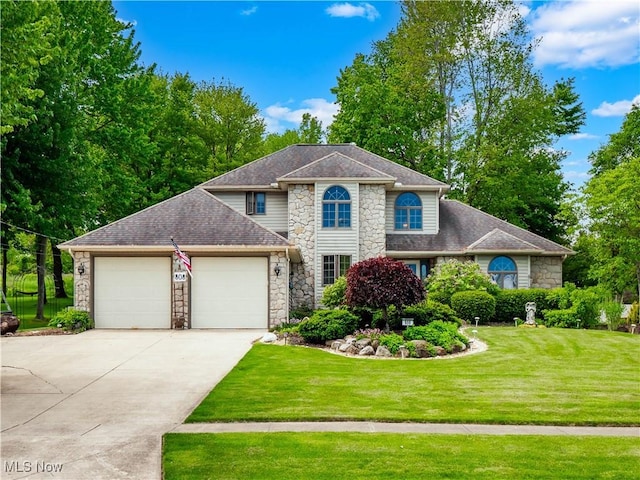808 Crestline Ave, Amherst, OH 44001 - view of front facade with stone siding, a garage, driveway, and a front lawn