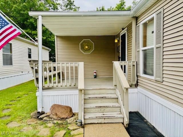 147 Northgate Dr NE, Warren, OH 44484 - doorway to property featuring covered porch