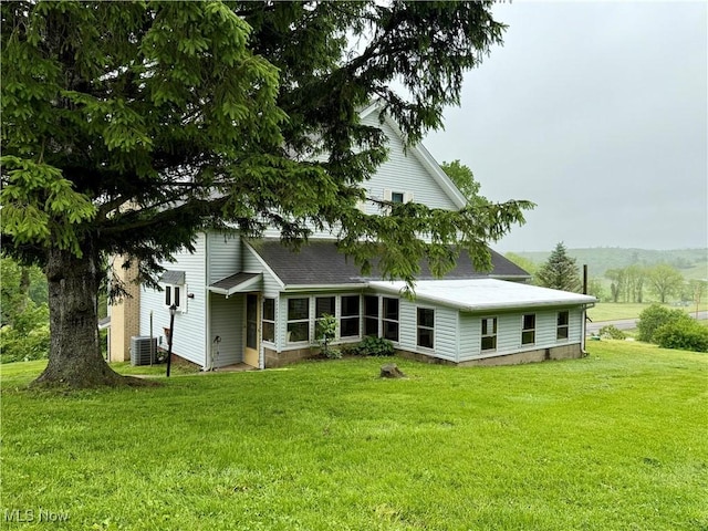 42096 Cadiz Dennison Rd, Cadiz, OH 43907 - back of property with a yard, cooling unit, and roof with shingles