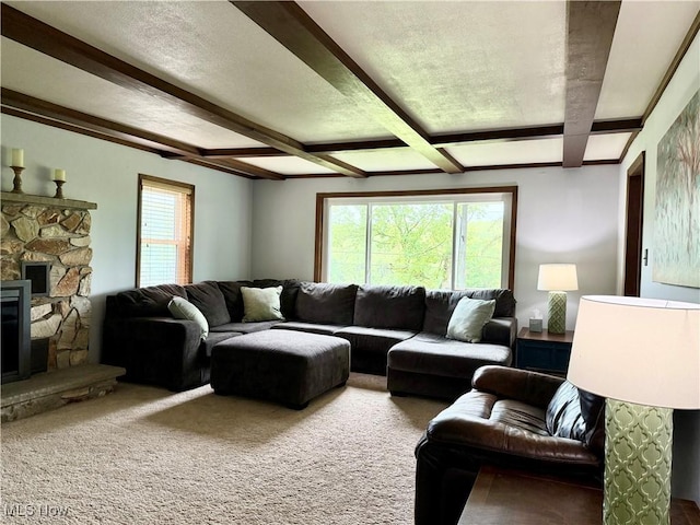 42096 Cadiz Dennison Rd, Cadiz, OH 43907 - carpeted living area featuring beamed ceiling, a stone fireplace, and healthy amount of natural light