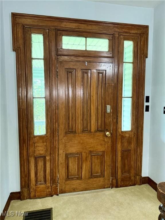 42096 Cadiz Dennison Rd, Cadiz, OH 43907 - entryway featuring baseboards, carpet floors, and healthy amount of natural light
