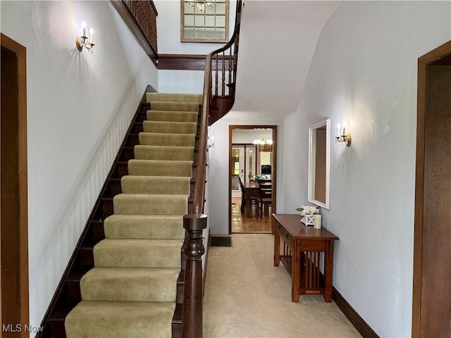 42096 Cadiz Dennison Rd, Cadiz, OH 43907 - stairs with lofted ceiling, carpet floors, and baseboards