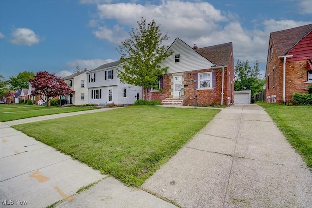 21411 Clare Ave, Maple Heights, OH 44137 - view of front facade featuring a front lawn, a chimney, and brick siding